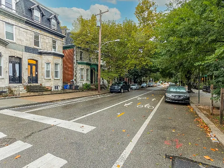 Tree-lined street with easy access to multiple bus lines and abuntant street parking