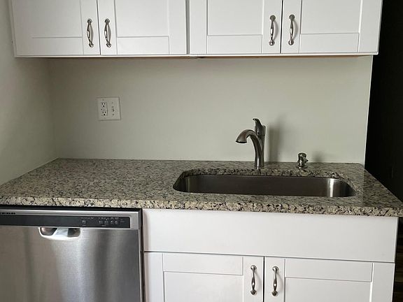Kitchen has all amenities including a stoned countertop.