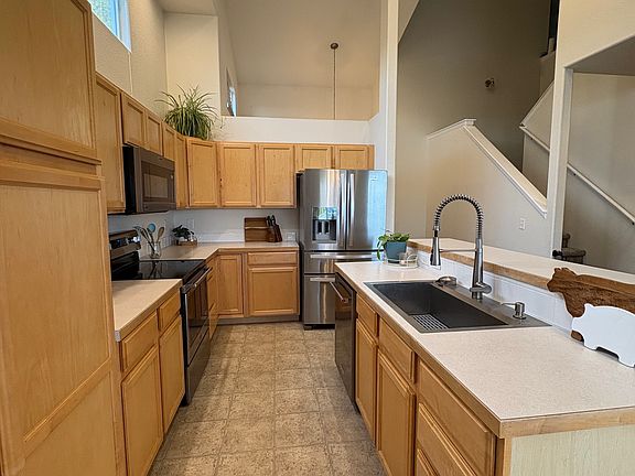 Kitchen with updated appliances and deep sink