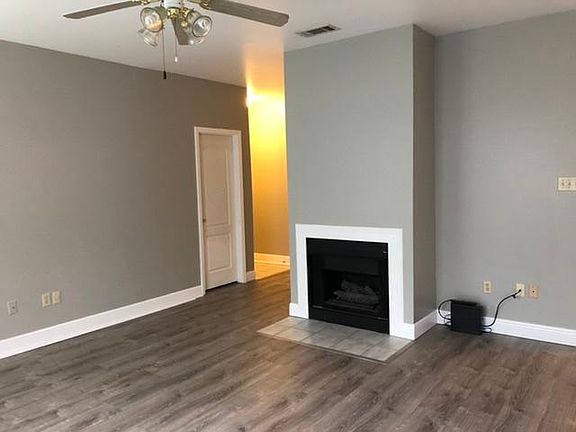 Den with Fireplace and new Luxury Plank Vinyl flooring