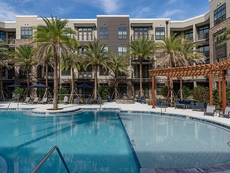 Experience upscale living with a stunning poolside view.