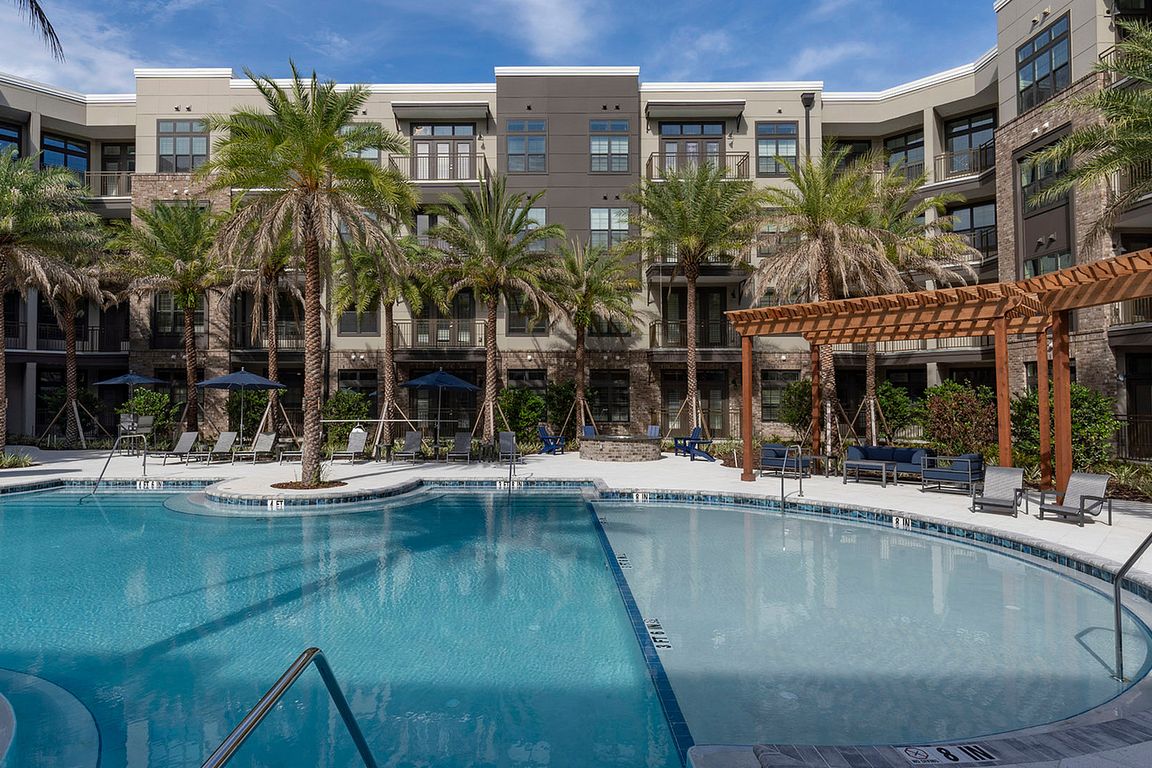 Experience upscale living with a stunning poolside view.