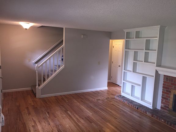Family room with gas fireplace and built in bookshelves