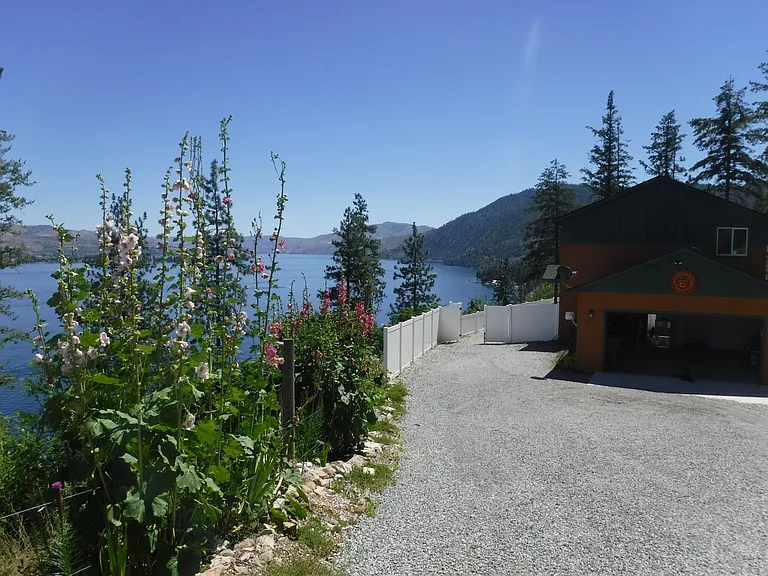 Private drive with attached garage and parking for 3 vehicles maximum.
