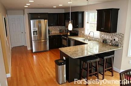professional stainless steel appliances,tile backsplash,granite