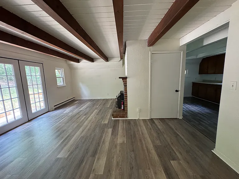 Living room looking at the door to the basement.