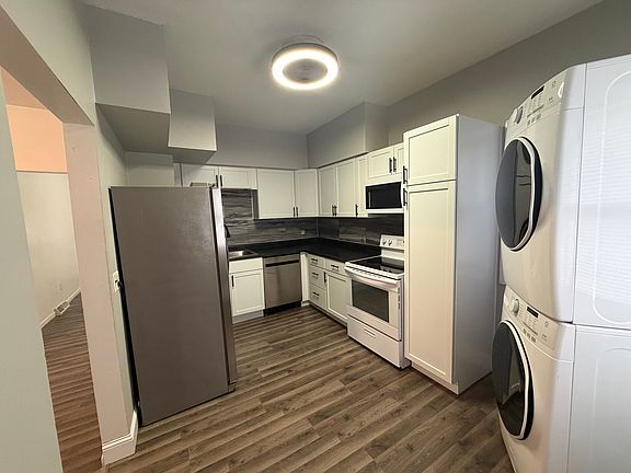 Kitchen (all new paint, cabinets, backsplash, countertops, dishwasher, microwave, stove, washer, dryer and flooring in fall 2025.)