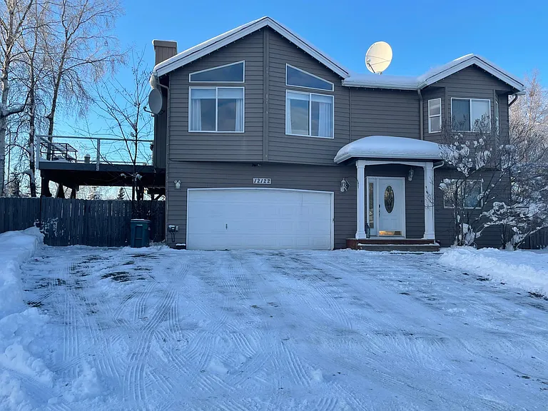 Front of the house with big driveway