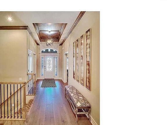High ceilings with vaults in main entry and custom crafted decorative trim detail. Rocker light switches and lever door handles are all standard. Gorgeous iron and glass front door with generous front porch.