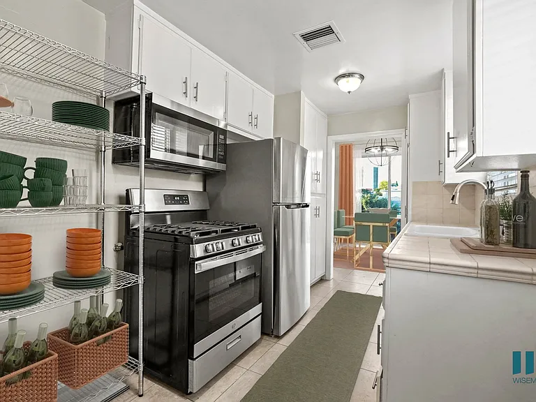 Kitchen with Stainless -Steel Refrigerator, Stove, Microwave Oven, and Dishwasher