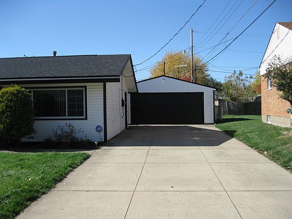 Paved drive to two car garag