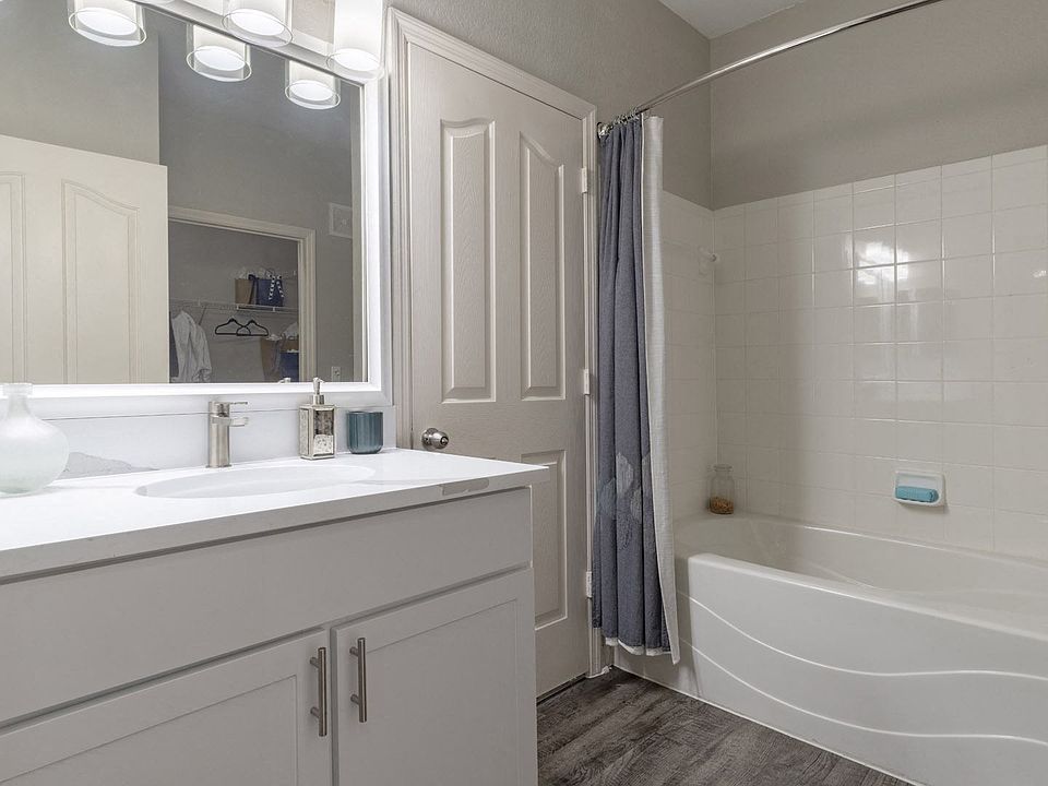 Modern Bathroom with Large Framed Mirror and Ample Storage
