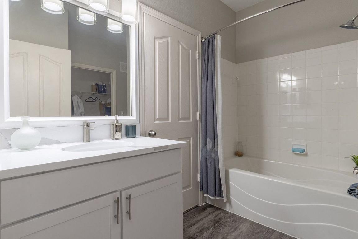 Modern Bathroom with Large Framed Mirror and Ample Storage