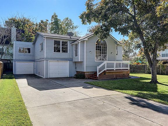 FRONT ELEVATION HIGHLIGHTS THE DOUBLE WIDE DRIVEWAY. PARK YOUR RV OR BOAT IN THE DRIVEWAY AND STILL HAVE PLENTY OF ROOM FOR PARKING.