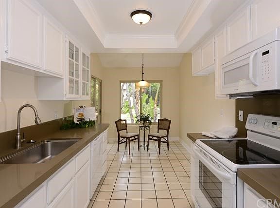 New dishwasher & microwave-STOVE IS ELECTRIC but there is a GAS HOOKUP as well! Generous eating-in kitchen, new LED's, country sink, Qortstone counters, faucet, disposer + + +