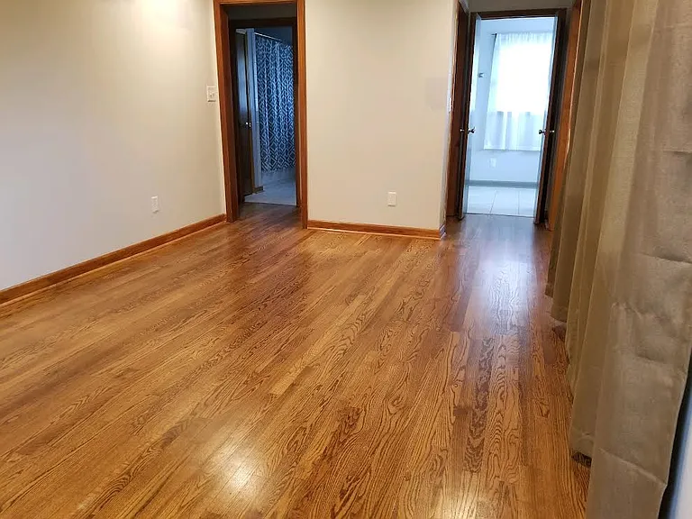 master bedroom, door to the left leads to a short hallway and the 2nd bathroom, door to the right leads to double closets and master bathroom