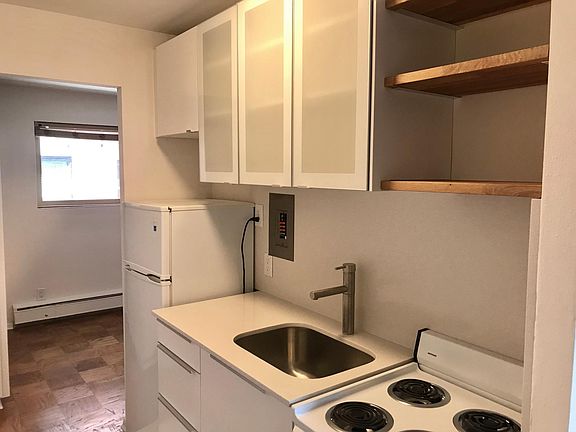 Brand new cabinets, quartz countertop and backsplash