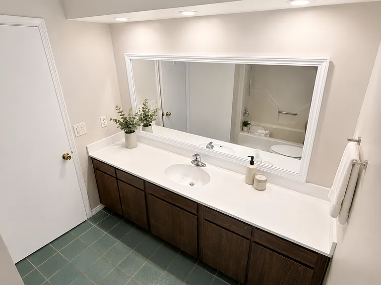 Second Bathroom - 
Spacious full bathroom featuring an oversized vanity with ample counter space, updated fixtures, and a full tub/shower combination; designed for both comfort and convenience.