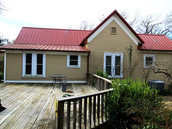 Back of home with deck