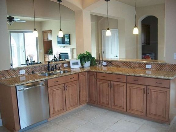 "Enjoy plentiful custom cabinetry with dovetailed, auto-close drawers...."