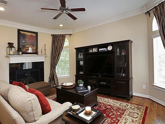 Great natural light and gas fireplace in living area.