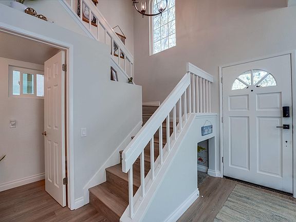 Entryway, 1/2 bathroom on the left, under stairs kids play cave, and stairs to all 3 bedrooms upstairs.