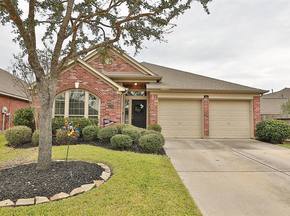 Front yard with beautiful, low-maintenance landscaping.