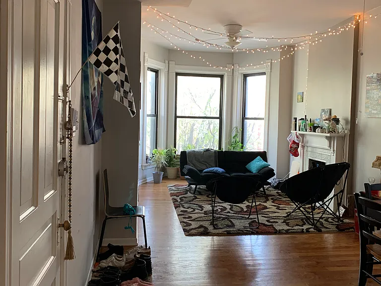 This is a picture of the living room / dining room of a different apartment to demonstrate what it would look like without the dividing wall.