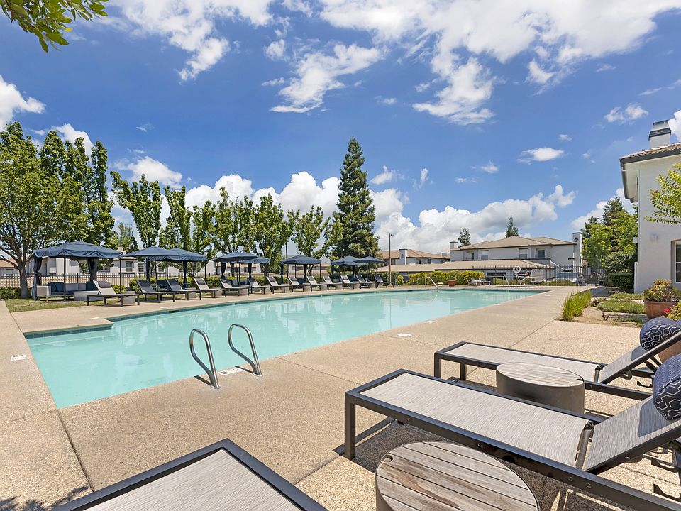 Dive into pure relaxation at Ascent at the Galleria's pool deck in Rosevilla, CAadorable cabanas and plush lounge chairs surround a sparkling pool, offering serene and stylish outdoor lounging vibes.