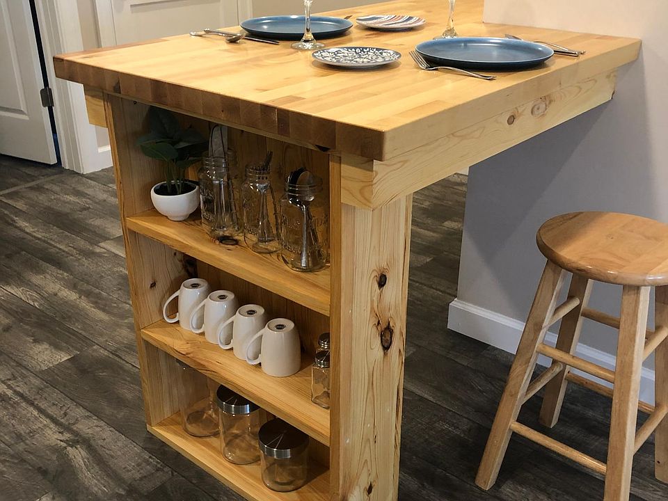 Built-in shelving area for added storage.