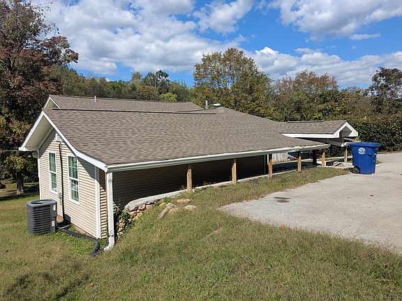 View of back of house, from parking area. Main entrance to house is from the back.