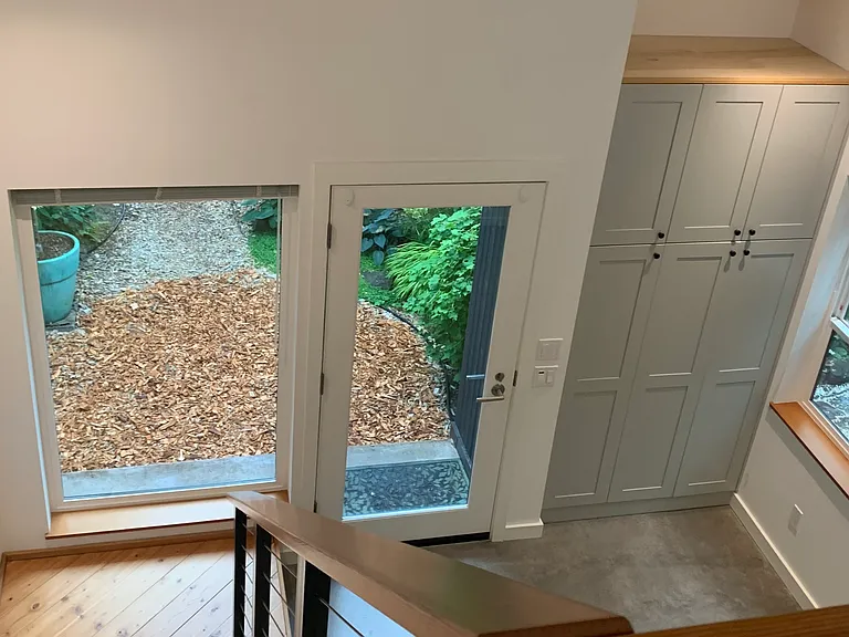 Looking down the stairs toward front door and living room.