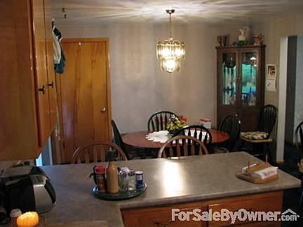Bar separates Kitchen from Dining Area : Dining Area is bigger than it appears in this picture