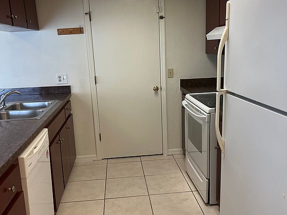 Galley Kitchen with door to garage