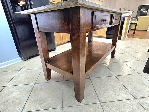 Artisan butcher block for added counterspace and storage.