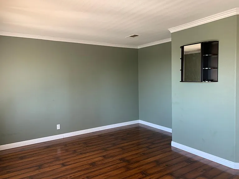 Very large master bedroom with natural light and entertainment space.