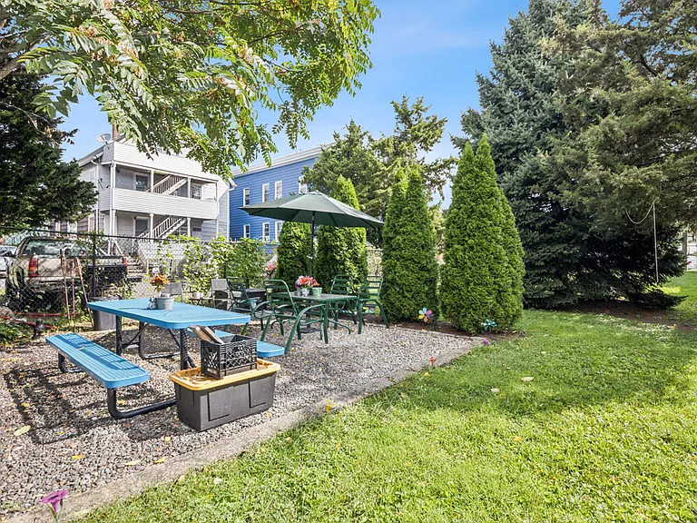 Fenced-In picnic area & lawn.