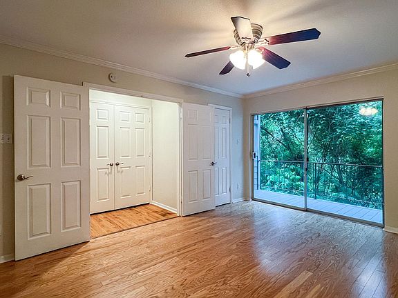 Master bedroom with walk in closet, deck overlooking Shoal Creek.