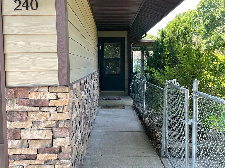 Front door entrance leads directly to the living room. Great for guests and pizza deliveries. It is separated from the fenced-in yard.