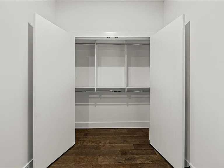 Flex Space / Den Closet (Note: Actual unit has light wooden floors and upgraded fixtures / appliances)