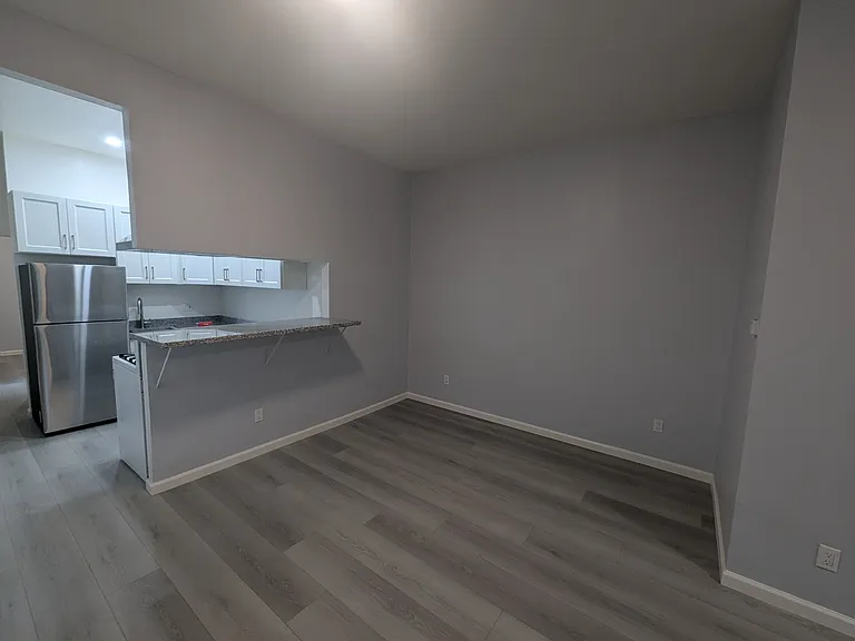 Living room. New floors and new lighting throughout.