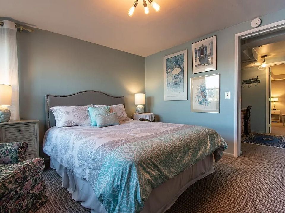 Another view of main bedroom which has a closet and desk in the adjacent bonus space