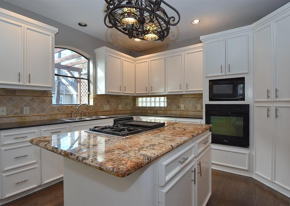 14x11. Kitchen - lots of cabinets for storage.