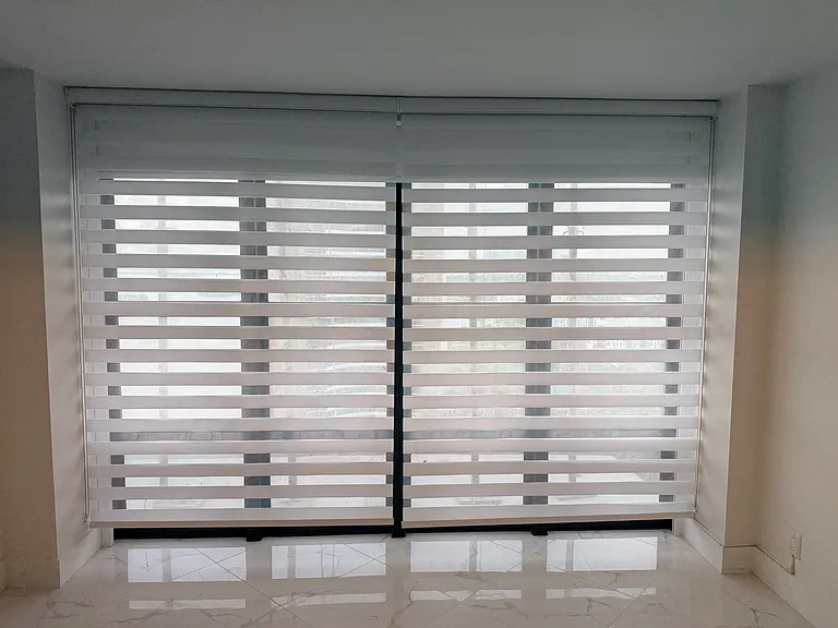 GUEST BEDROOM or OFFICE with dimmable designer lighting, full wall mirror, floor-to-ceiling impact windows, electric blackout curtain, zebra shades & large closet system