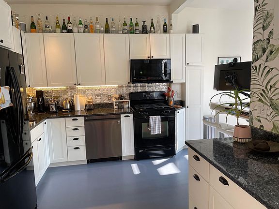 Fully stocked kitchen that includes a dishwasher and garbage disposal.