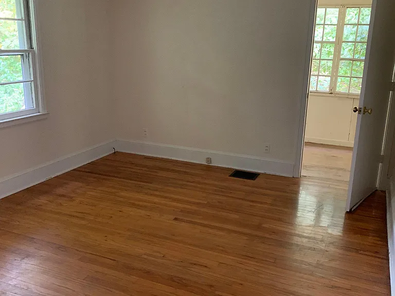 Master bedroom with 3 season room and deck