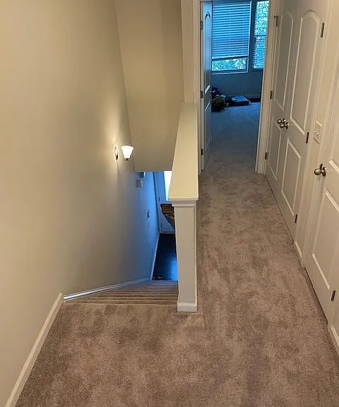 Upstairs hallway going to second bedroom.