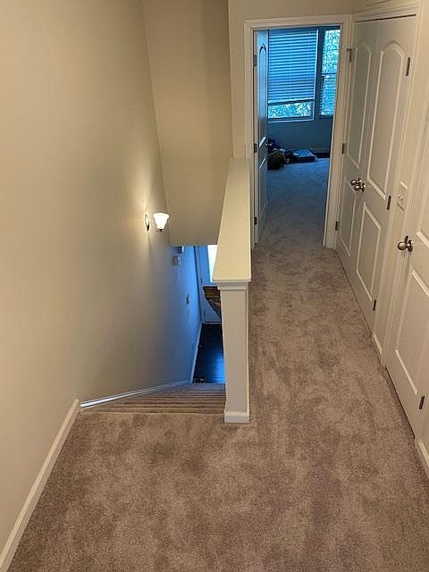 Upstairs hallway going to second bedroom.