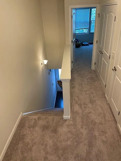 Upstairs hallway going to second bedroom.