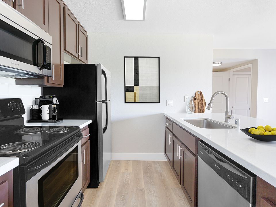 Your gourmet kitchen features brushed nickel finishes and generous storage